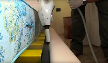 The images showsthe Polti Cimex Eradicator Plus with concentrator accessory usage on the slat