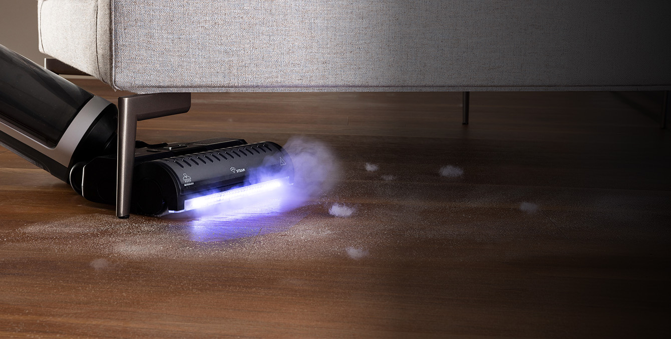 Polti RollySteam cleaning under a sofa